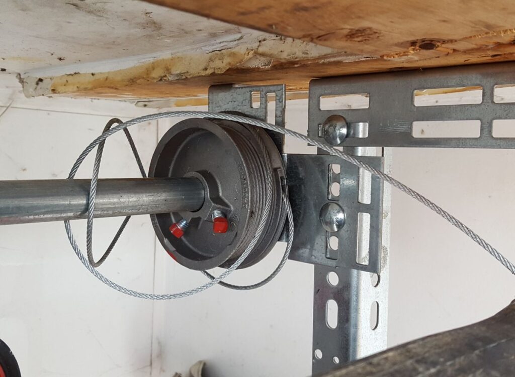 Image of a broken garage door cable needing repair. Noah's Garage Doors, Elk Grove, Sacramento, Folsom